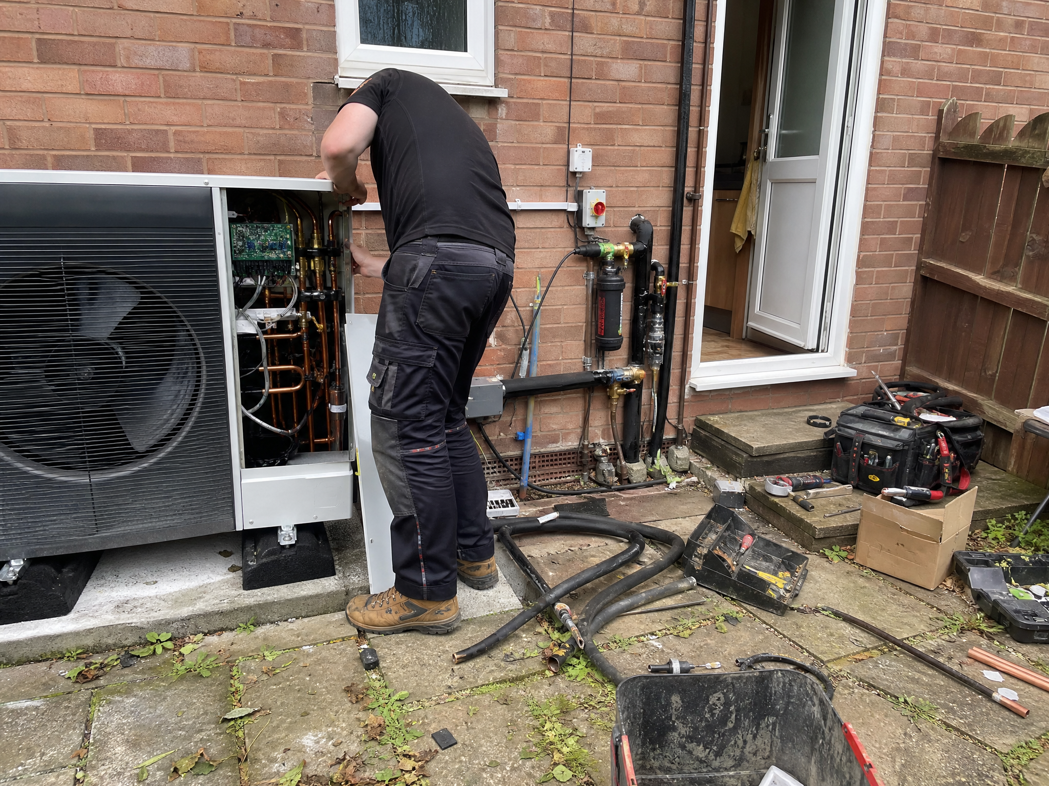 Overview of heat pump servicing & repairs work in progress at a British residential property